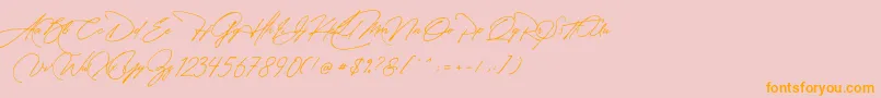 フォントManchester Signature – オレンジの文字がピンクの背景にあります。
