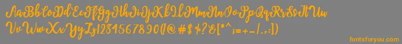 More about Manda Script Font Manda Script Font – Orange Fonts on Gray Background