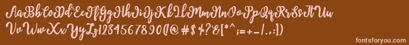 Czcionka Manda Script – różowe czcionki na brązowym tle