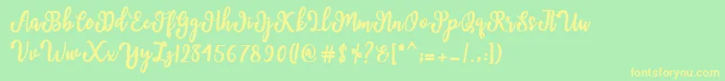 Czcionka Manda Script – żółte czcionki na zielonym tle