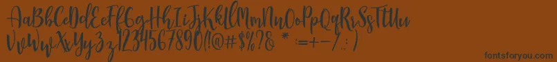 Czcionka Manda – czarne czcionki na brązowym tle