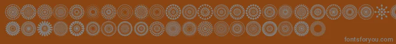 Fonte Mandalas pro – fontes cinzas em um fundo marrom