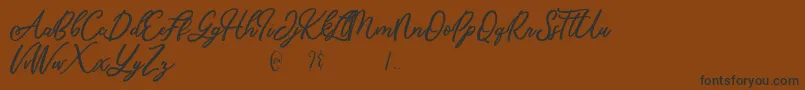 Mandymores-Schriftart – Schwarze Schriften auf braunem Hintergrund