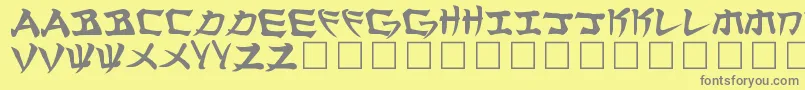 Manglo-fontti – harmaat kirjasimet keltaisella taustalla