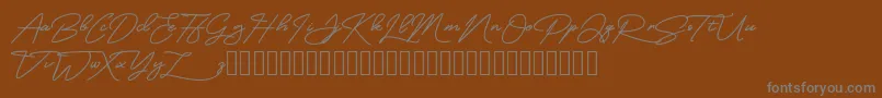 MangoSign-Schriftart – Graue Schriften auf braunem Hintergrund