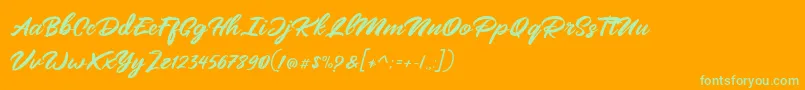フォントMangotea   FREE PERSONAL USE – オレンジの背景に緑のフォント