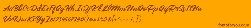 Mangotea   FREE PERSONAL USE-Schriftart – Braune Schriften auf orangefarbenem Hintergrund