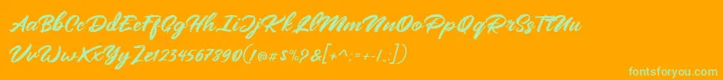 Mangotea   FREE PERSONAL USE-Schriftart – Grüne Schriften auf orangefarbenem Hintergrund