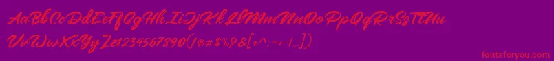 Mangotea   FREE PERSONAL USE-Schriftart – Rote Schriften auf violettem Hintergrund