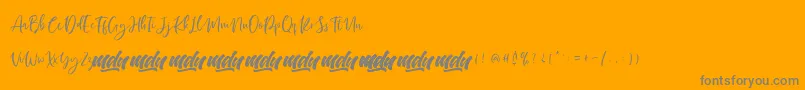 Manilla Script   FREE PERSONAL-Schriftart – Graue Schriften auf orangefarbenem Hintergrund