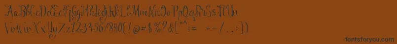 Manny Script-Schriftart – Schwarze Schriften auf braunem Hintergrund