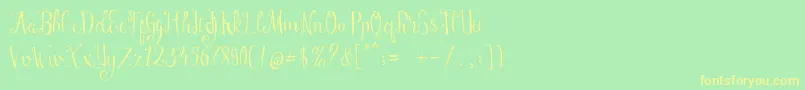 フォントManny Script – 黄色の文字が緑の背景にあります