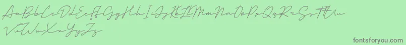 Mansions Demo-Schriftart – Graue Schriften auf grünem Hintergrund