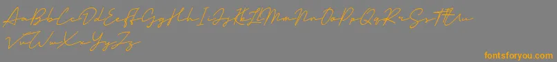 Mansions Demo-Schriftart – Orangefarbene Schriften auf grauem Hintergrund