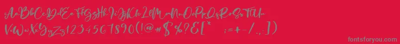 Czcionka Manstro Brush Style – szare czcionki na czerwonym tle