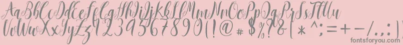 Mantana free -Schriftart – Graue Schriften auf rosa Hintergrund