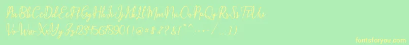 Maqella Script Font – Yellow Fonts on Green Background