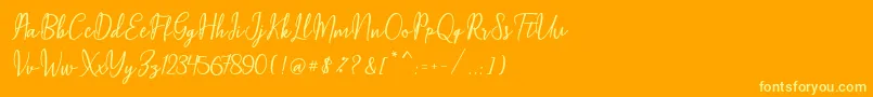 Maqella Script-Schriftart – Gelbe Schriften auf orangefarbenem Hintergrund