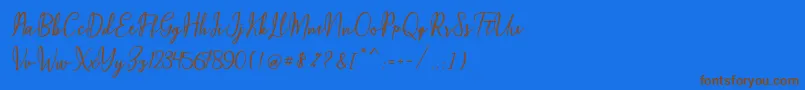 Maqella Script Font – Brown Fonts on Blue Background