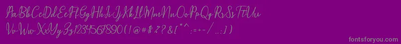 Fonte Maqella Script – fontes cinzas em um fundo violeta