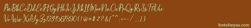 Maqella Script Font – Green Fonts on Brown Background