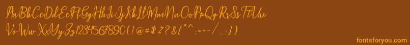 fuente Maqella Script – Fuentes Naranjas Sobre Fondo Marrón