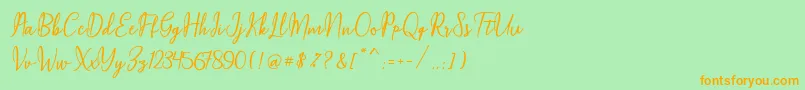 Maqella Script Font – Orange Fonts on Green Background