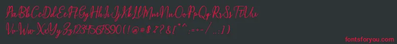Maqella Script Font – Red Fonts on Black Background