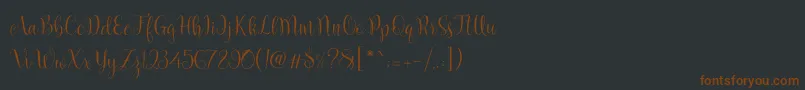 フォントMarcellina Script – 黒い背景に茶色のフォント