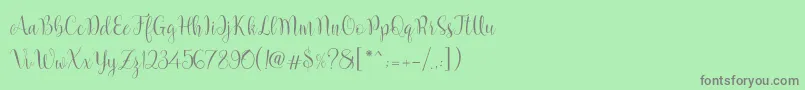 フォントMarcellina Script – 緑の背景に灰色の文字