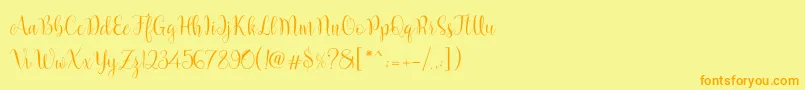 フォントMarcellina Script – オレンジの文字が黄色の背景にあります。
