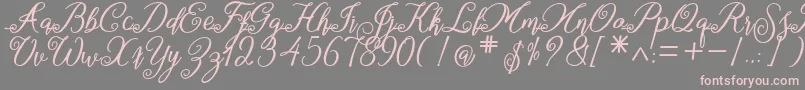 marganbetan-Schriftart – Rosa Schriften auf grauem Hintergrund