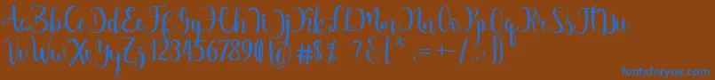 Margarita Free Font – Blue Fonts on Brown Background