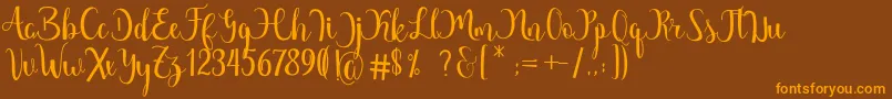Margarita Free Font – Orange Fonts on Brown Background
