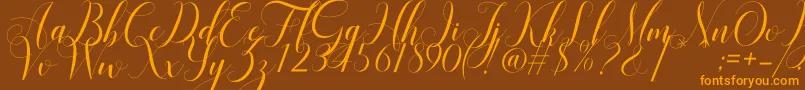 Mariana Oghawa-Schriftart – Orangefarbene Schriften auf braunem Hintergrund