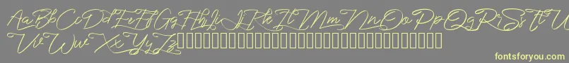 marikita Font – Yellow Fonts on Gray Background