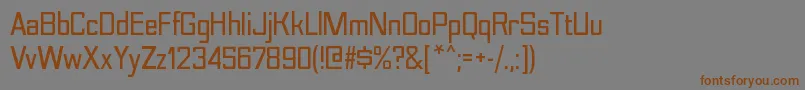 フォントNesobritescBold – 茶色の文字が灰色の背景にあります。