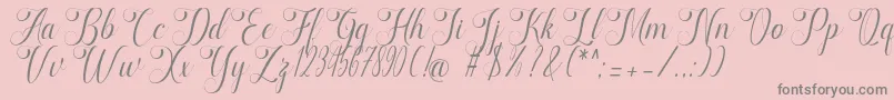 marketing-fontti – harmaat kirjasimet vaaleanpunaisella taustalla