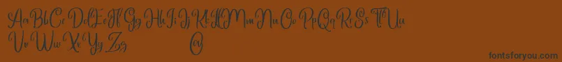 Marlyana free for personal use-Schriftart – Schwarze Schriften auf braunem Hintergrund