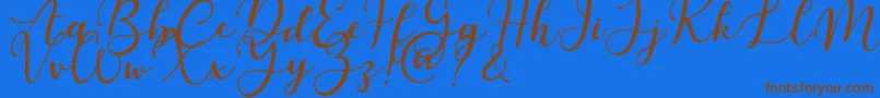 Martinesse Font – Brown Fonts on Blue Background