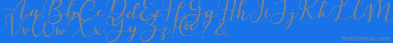 Martinesse-Schriftart – Graue Schriften auf blauem Hintergrund