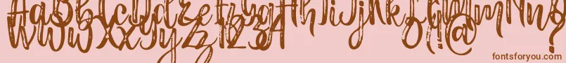Masha-Schriftart – Braune Schriften auf rosa Hintergrund
