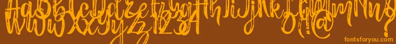 Masha Font – Orange Fonts on Brown Background