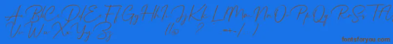 Mathanifo Script dafont-Schriftart – Braune Schriften auf blauem Hintergrund