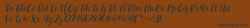 Maxeva by 7NTypes D-Schriftart – Schwarze Schriften auf braunem Hintergrund