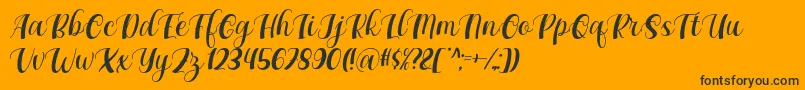 Maxeva by 7NTypes D Font – Black Fonts on Orange Background