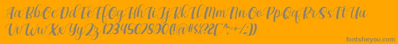 Maxeva by 7NTypes D-Schriftart – Graue Schriften auf orangefarbenem Hintergrund