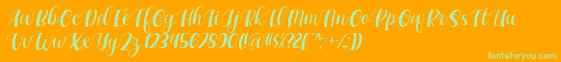 Maxeva by 7NTypes D-Schriftart – Grüne Schriften auf orangefarbenem Hintergrund