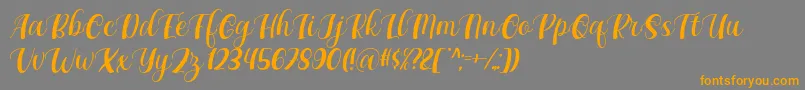 Maxeva by 7NTypes D-fontti – oranssit fontit harmaalla taustalla