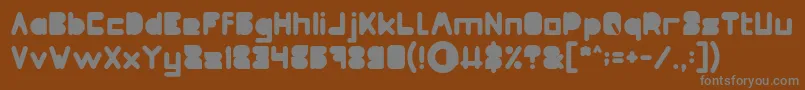 フォントMAXIMUM KILOMETER Filled – 茶色の背景に灰色の文字
